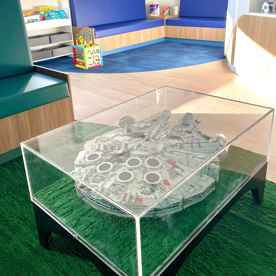 A Lego display table in the kids' corner